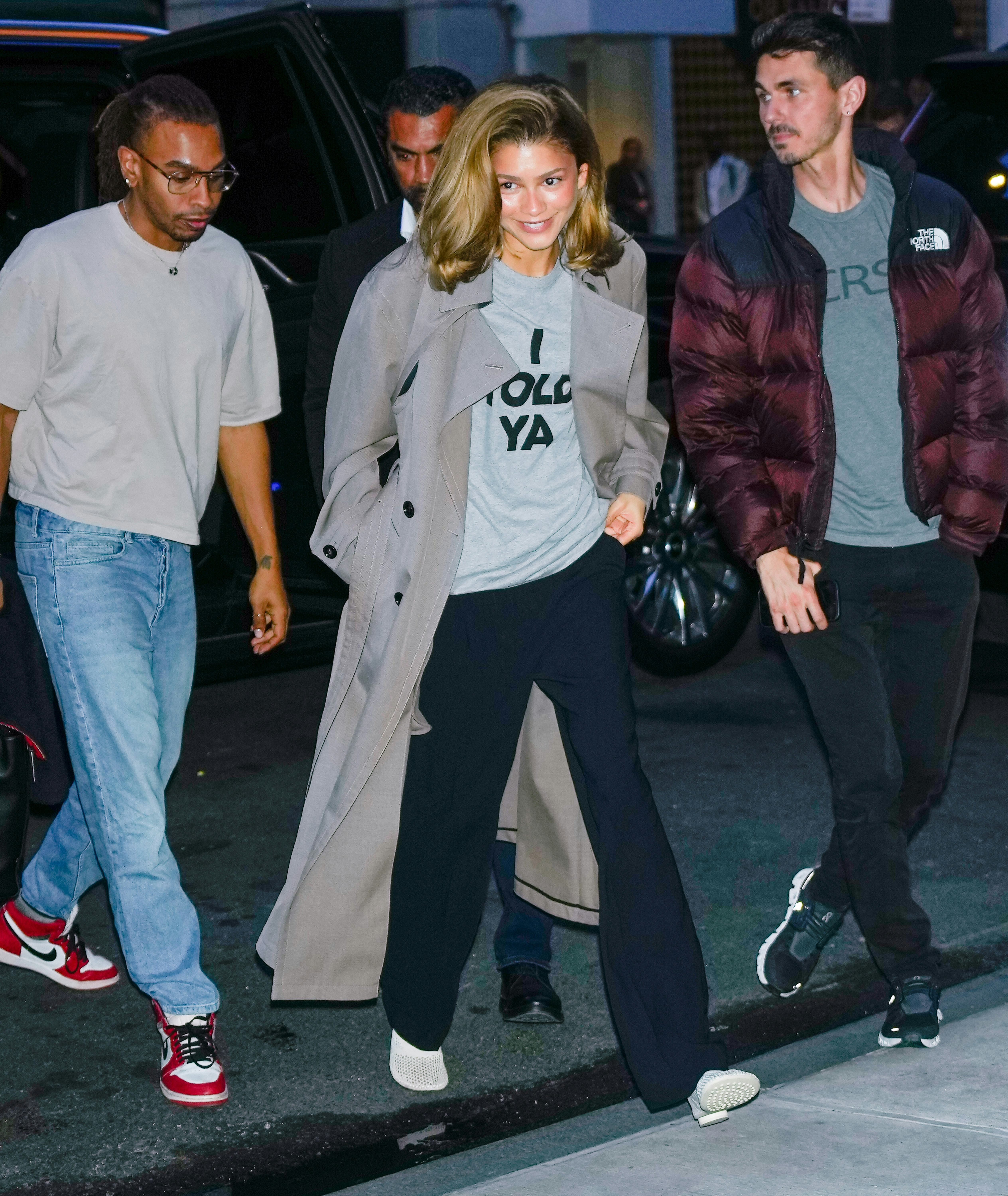 Zendaya wears the &ldquo;I TOLD YA&rdquo; shirt with black trousers and a trench coat on April 22, 2024 in New Y&hellip;