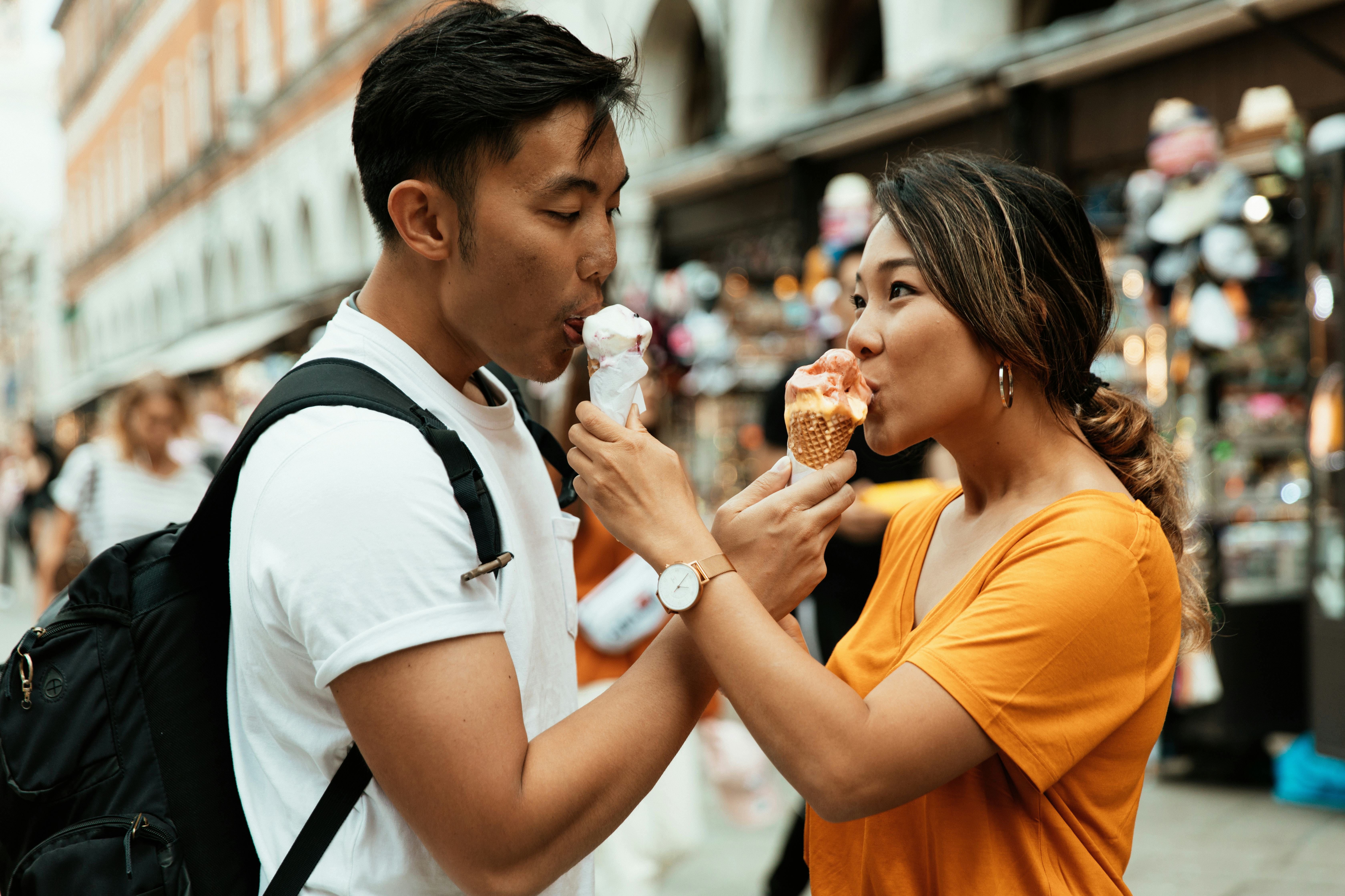 A couple feeding each other ice cream on a trip, giving each other girlfriend and boyfriend nickname&hellip;