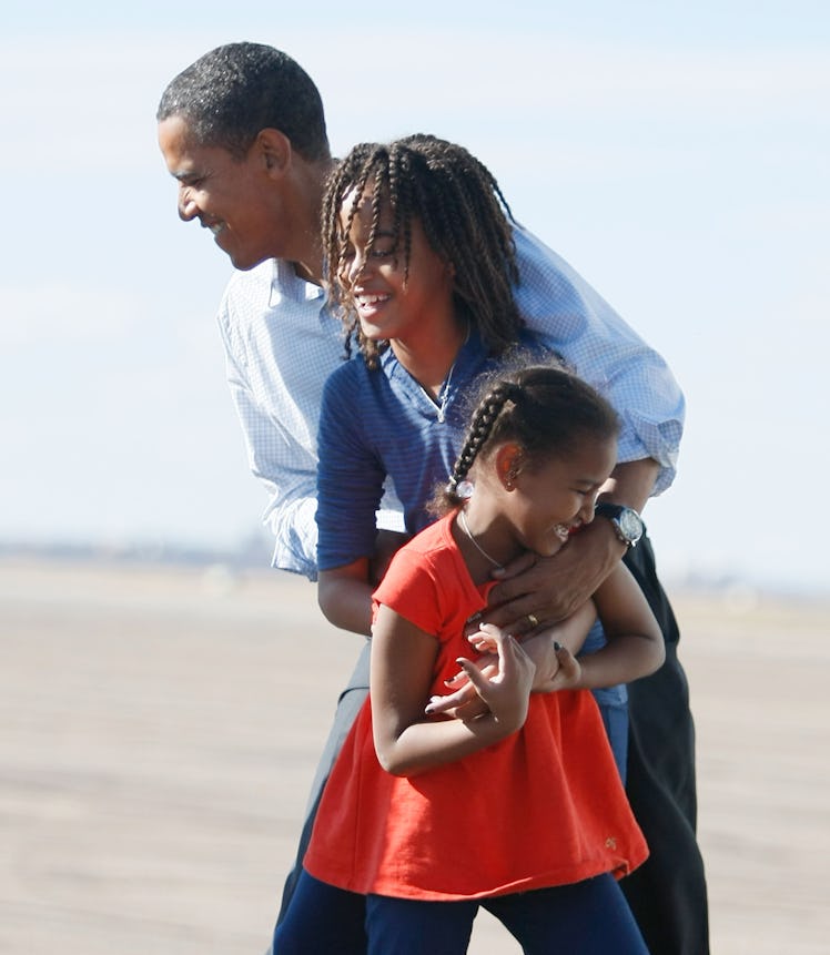 Democratic presidential nominee U.S. Sen. Barack Obama (D-IL) is greeted by his daughter, Malia (C) ...