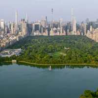 Aerial view of Central Park with Central Park Reservoir surrounded by modern skyscraper in New York ...