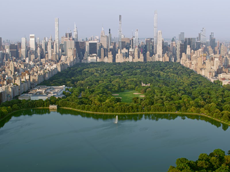 Aerial view of Central Park with Central Park Reservoir surrounded by modern skyscraper in New York ...