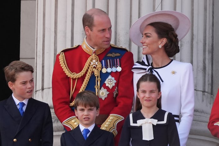 Princess Charlotte keeps a weather eye on Prince Louis.