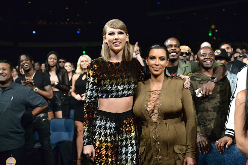 Taylor Swift and Kim Kardashian attend the 2015 VMAs