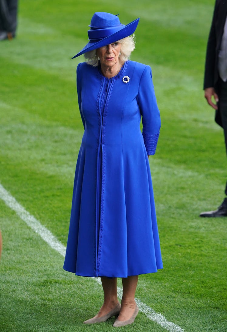 Queen Camilla stands in the parade ring ahead of the King Charles III Stakes on day one of Royal Asc...