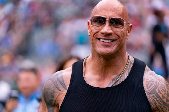 ARLINGTON, TX - MARCH 30: UFL Owner Dwayne Johnson ,The Rock, walks on the field before an UFL game ...