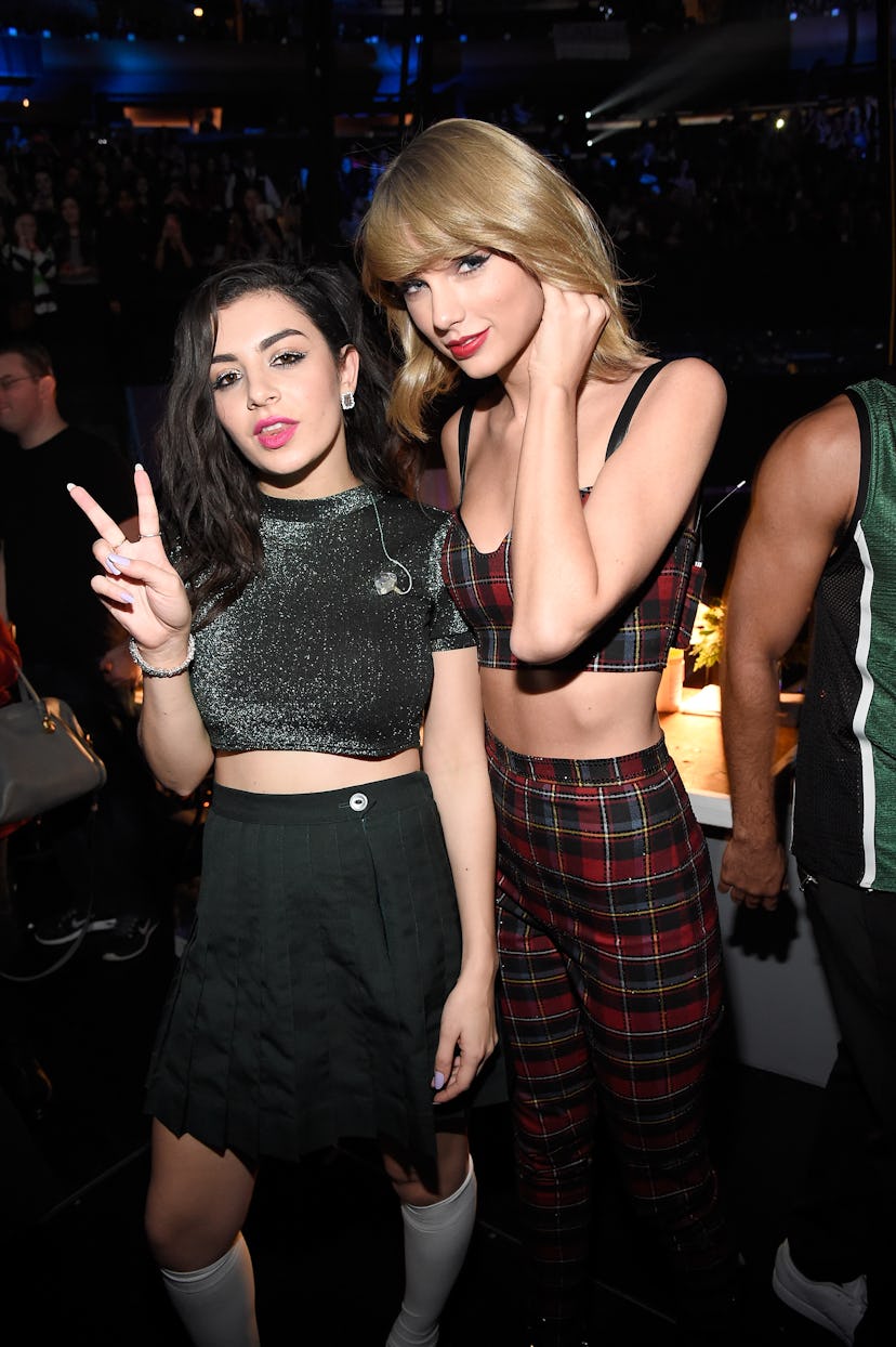 Charli XCX and Taylor Swift pose backstage