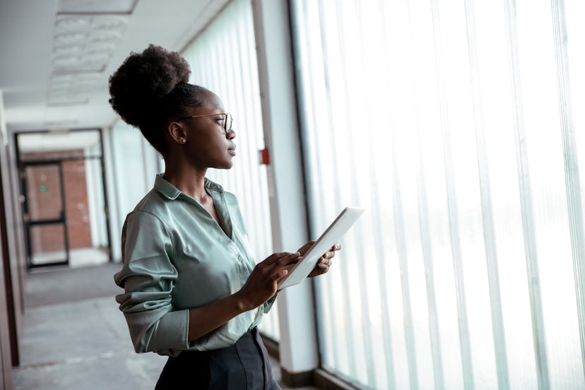 are riddles critical thinking An intelligent young woman stands in front of an office window with a tablet and thinks about hard l...