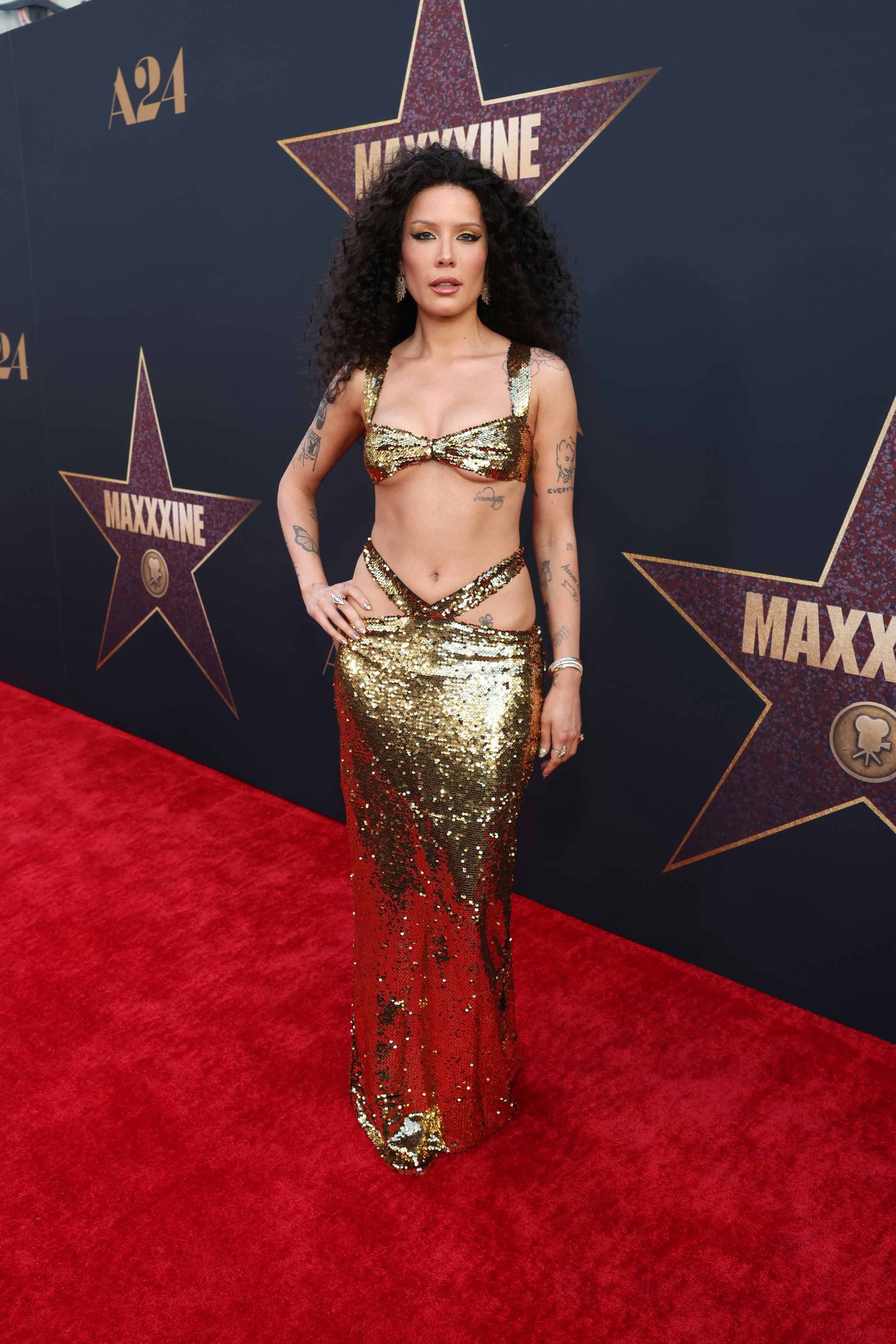 Halsey wears a sequined gold two-piece to attend the world premiere of A24&rsquo;s &ldquo;MAXXXINE&rdquo; on June 24, &hellip;