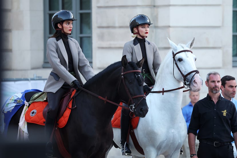 Kendall Jenner and Gigi Hadid ride horses on the runway during Vogue World: Paris at Place Vendome o...