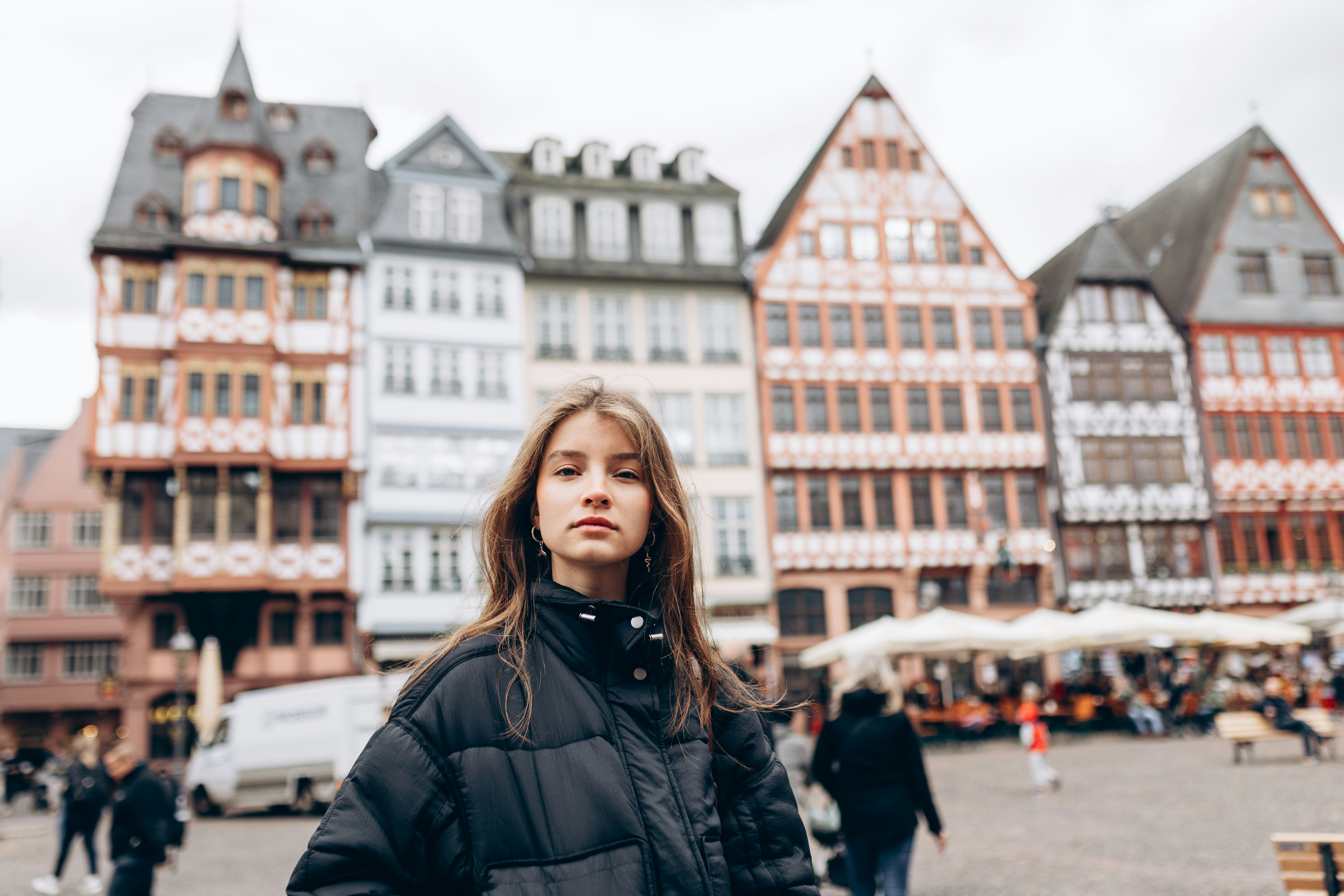 A young woman stands in her hometown that she shared about as her fun fact about me.