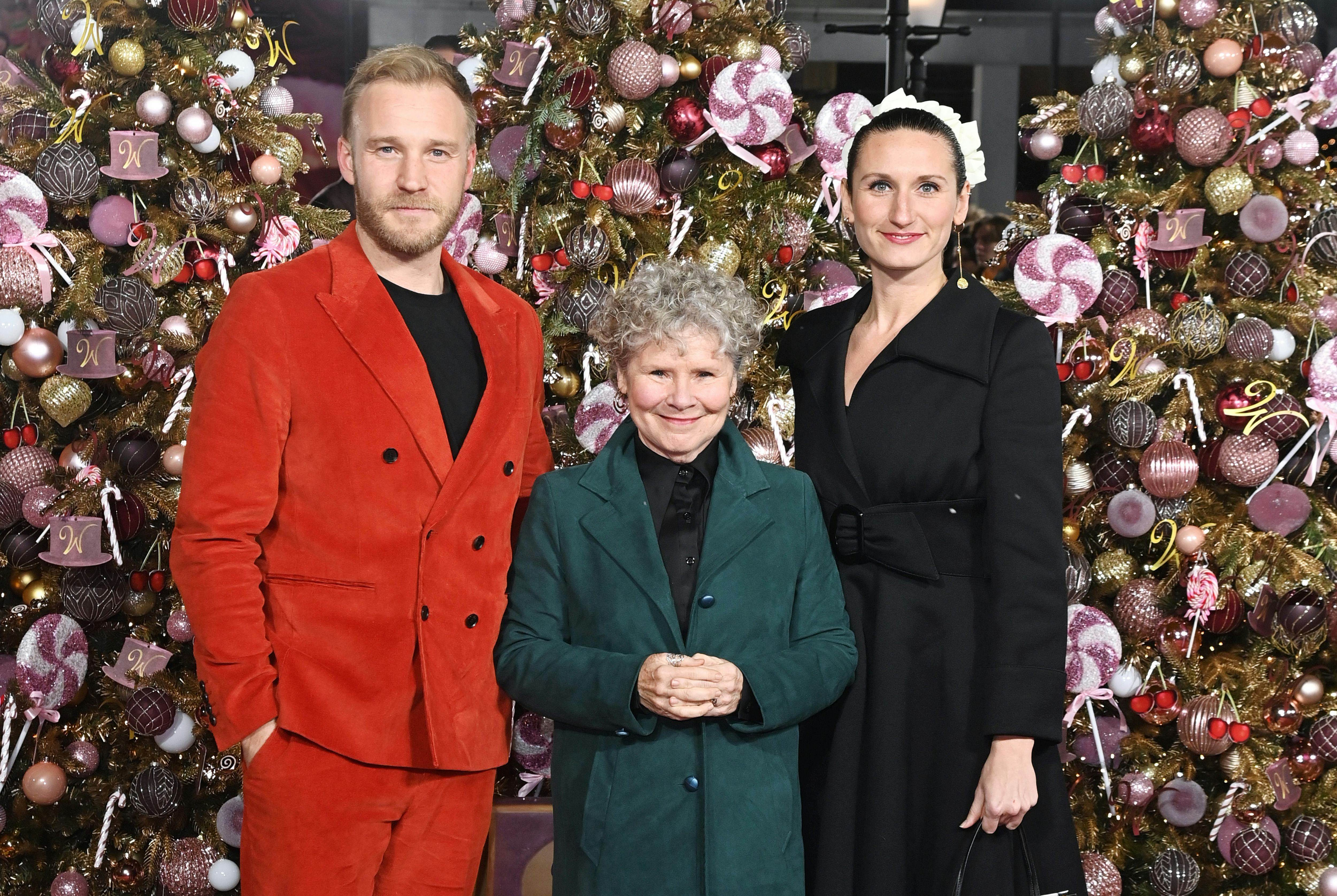 LONDON, ENGLAND - NOVEMBER 28: (L to R) Sam Phillips, Imelda Staunton and Bessie Carter attend the W&hellip;