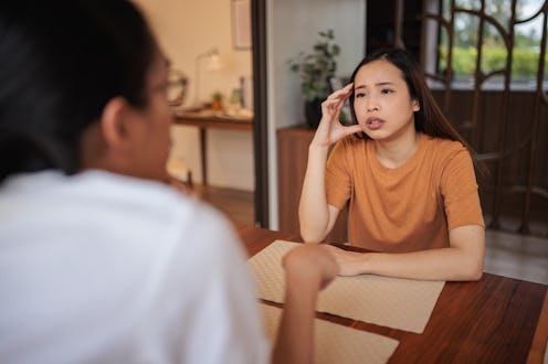 Young couple openly discuss their challenges and share problems at home.