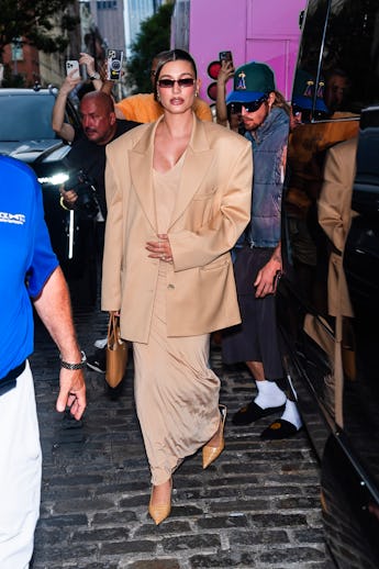 NEW YORK, NEW YORK - JUNE 23: Hailey Bieber attends a pop-up for Rhode in SoHo on June 23, 2024 in N...
