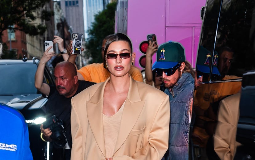 NEW YORK, NEW YORK - JUNE 23: Hailey Bieber attends a pop-up for Rhode in SoHo on June 23, 2024 in N...
