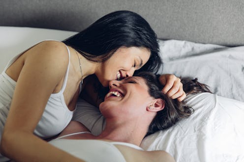 Young adult homosexual couple enjoying daily life at home.