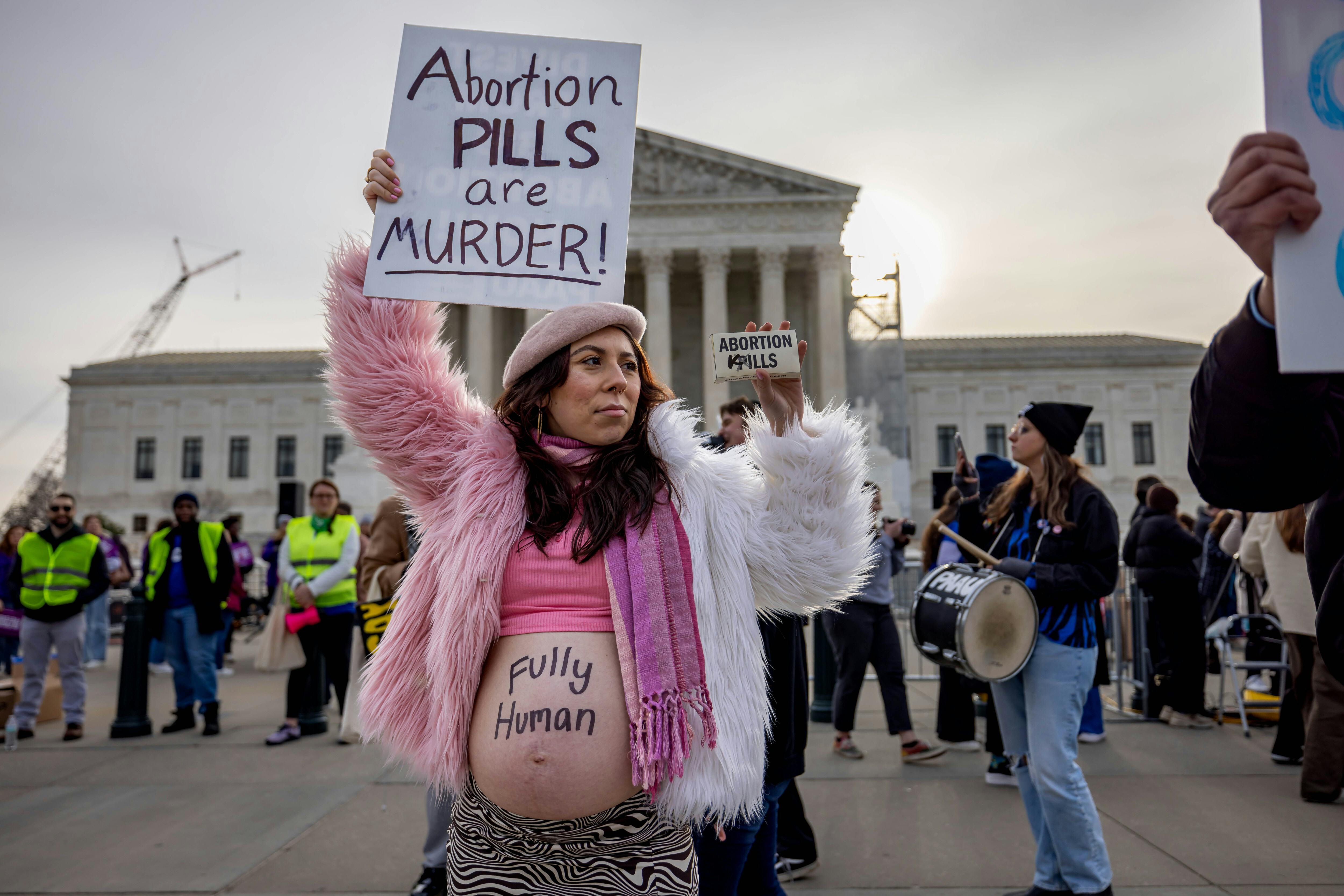 A pro-life supporter rallies against abortion pills.