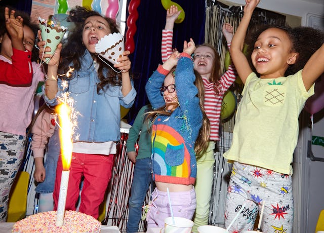 A group of young girls having fun with their friends at a birthday celebration