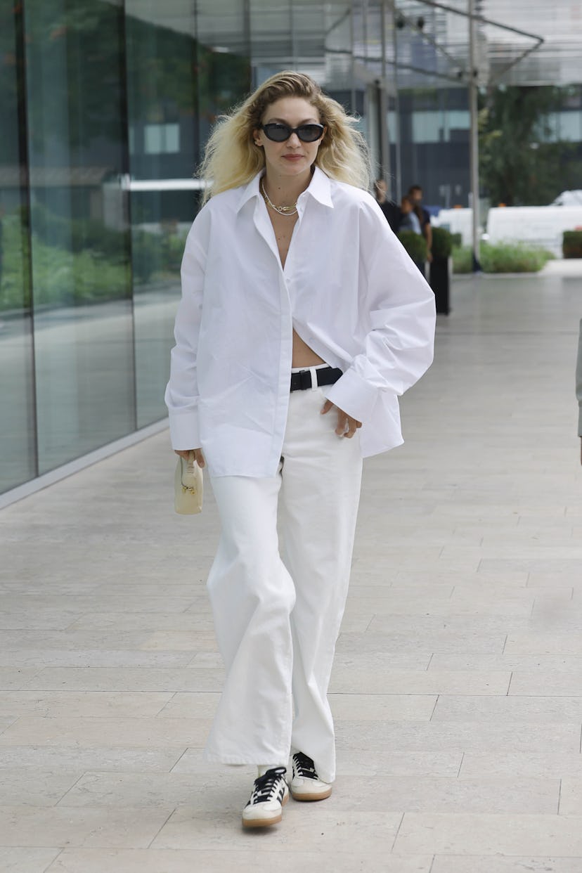 Gigi Hadid wears an all-white outfit seen during the Milan Fashion Week - Womenswear Spring/Summer 2…