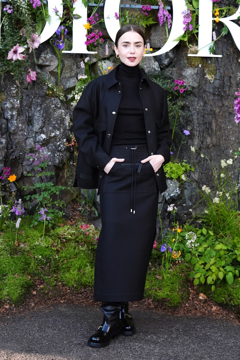 Lily Collins wears an all-black outfit to attend the Dior Cruise 2025 show on June 3, 2024 in Edinbu…
