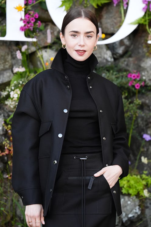 Lily Collins wears an all-black outfit to attend the Dior Cruise 2025 show on June 3, 2024 in Edinbu...