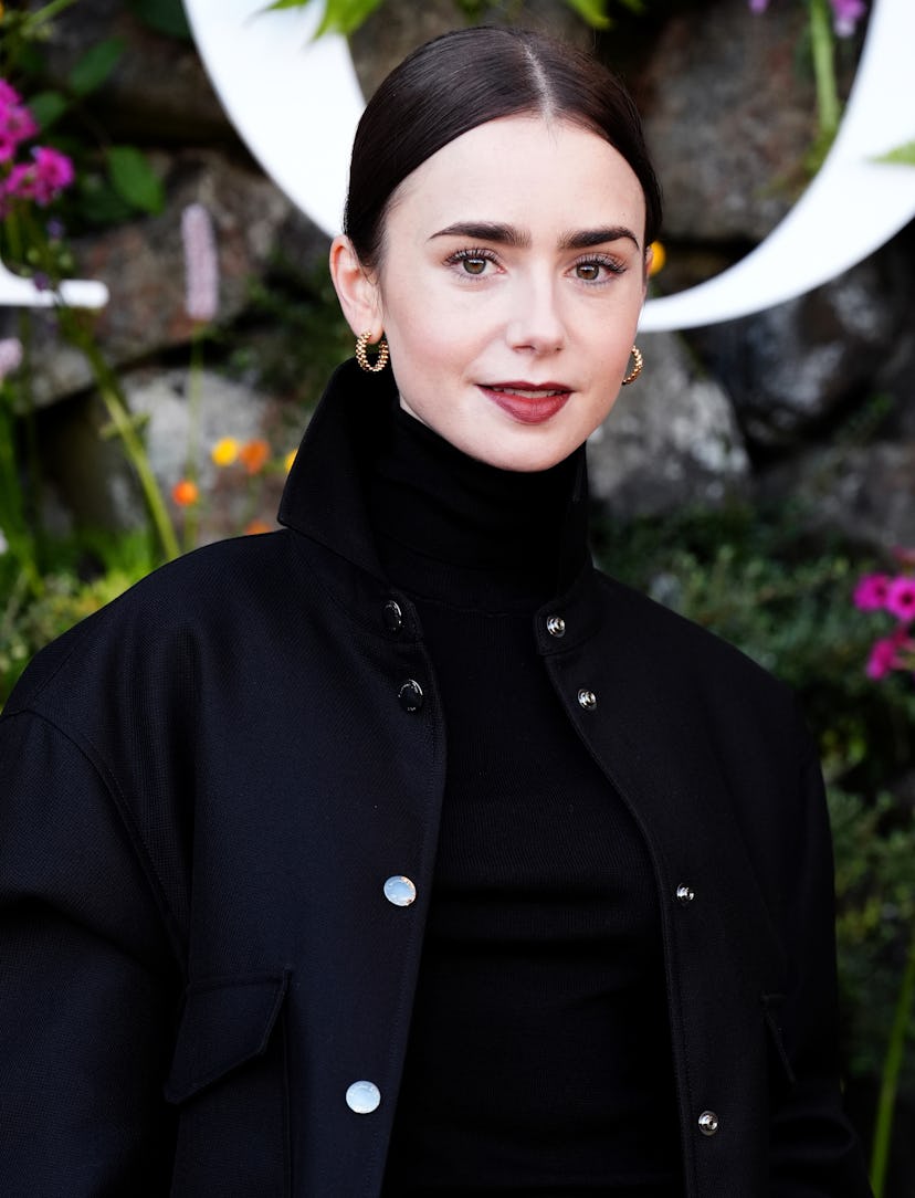 Lily Collins wears an all-black outfit to attend the Dior Cruise 2025 show on June 3, 2024 in Edinbu…