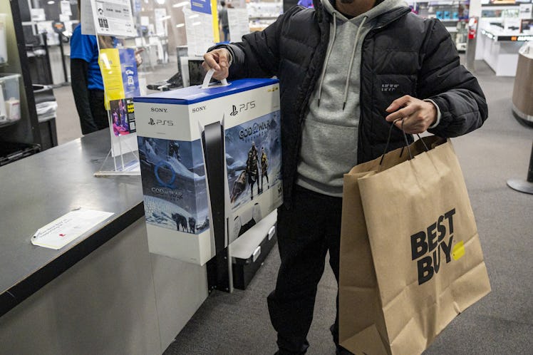 A shopper with a Sony Playstation 5 at a Best Buy store on Black Friday in San Francisco, California...