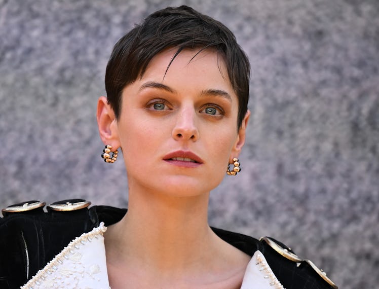 English actor Emma Corrin poses on the red carpet upon arrival to attend the UK sneak peek event for...