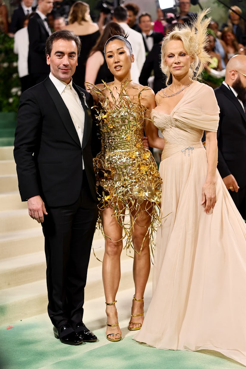 Fernando Garcia, Laura Kim, and Pamela Anderson at the 2024 Met Gala celebrating "Sleeping Beauties:...