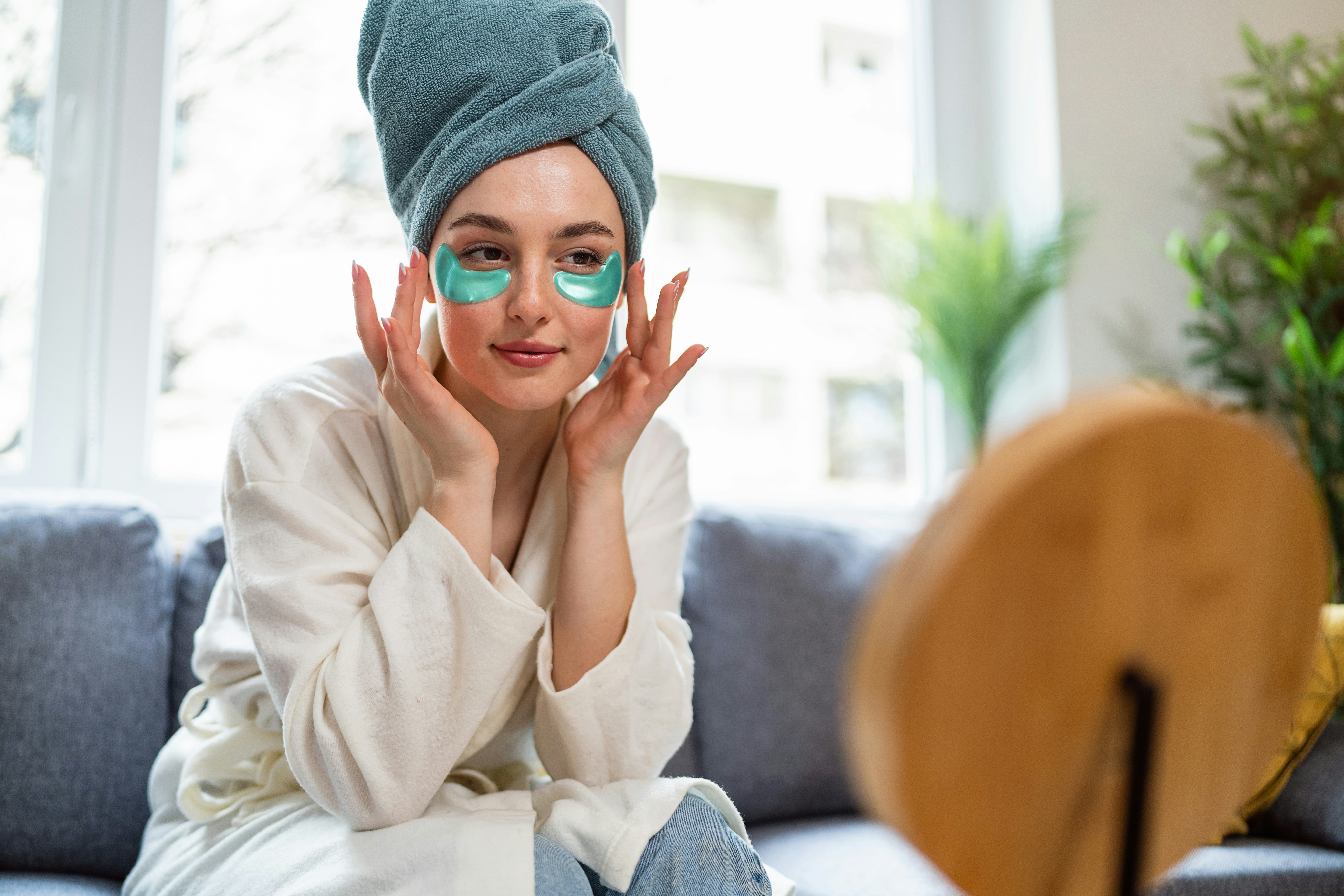 Young woman doing her beauty routine at home.