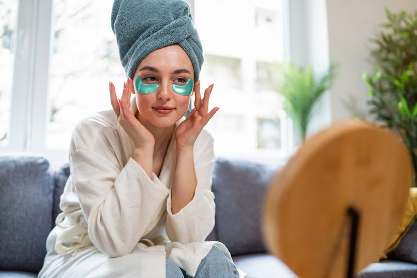 Young woman doing her beauty routine at home.