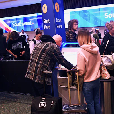 ORLANDO, FLORIDA, UNITED STATES - DECEMBER 22: Passengers are seen at the Southwest Airlines ticket counter at Orlando International Airport ahead of the Christmas holiday travel on December 22, 2023 in Orlando, Florida. According to the travel organization AAA estimates 7.5 million people will travel by air, surpassing 2019's record of 7.3 million passengers. (Photo by Paul Hennesy/Anadolu via Getty Images)