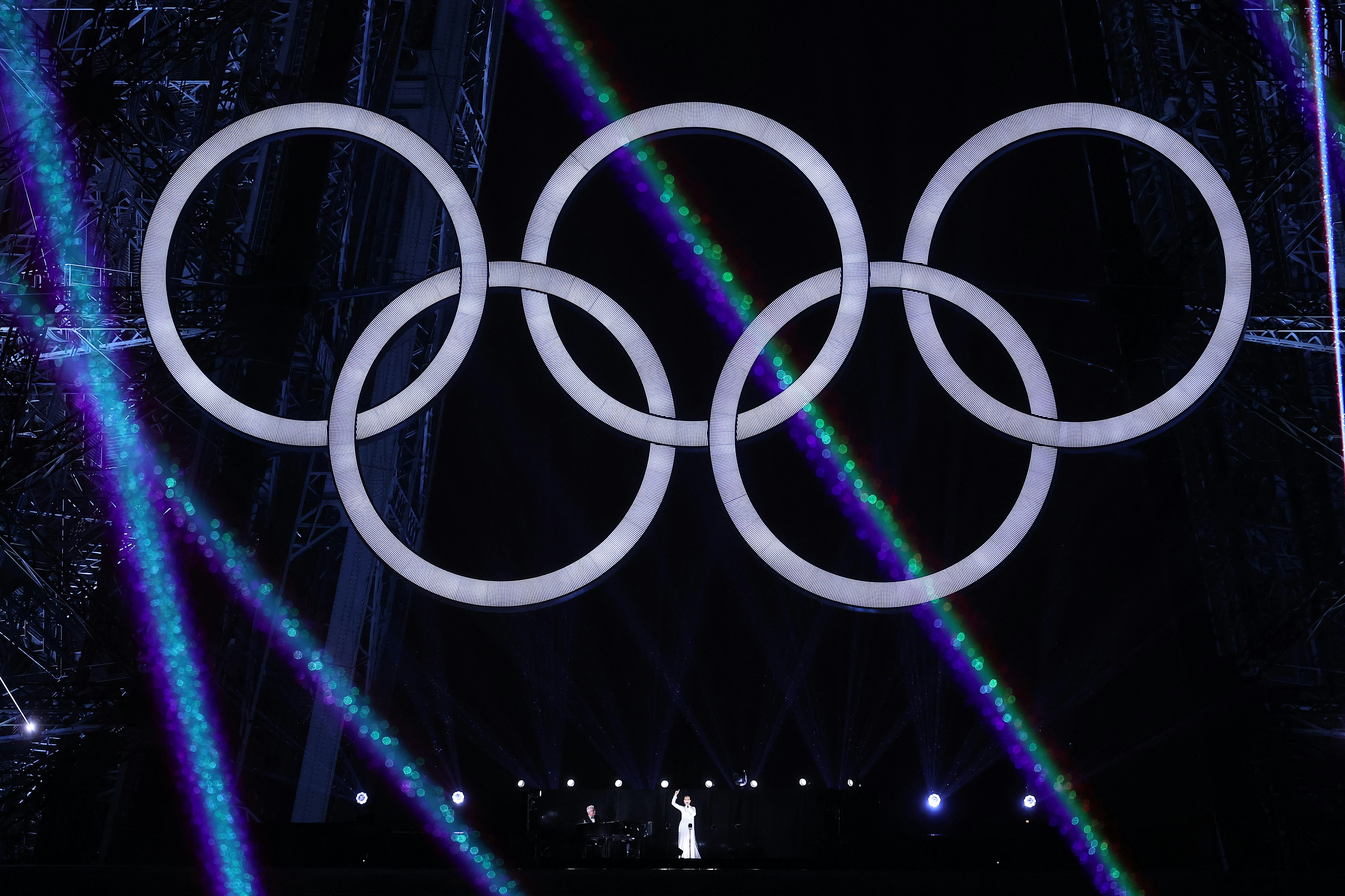 PARIS, FRANCE - JULY 26: Canadian Singer Celine Dion performs on the Eiffel Tower at the conclusion &hellip;