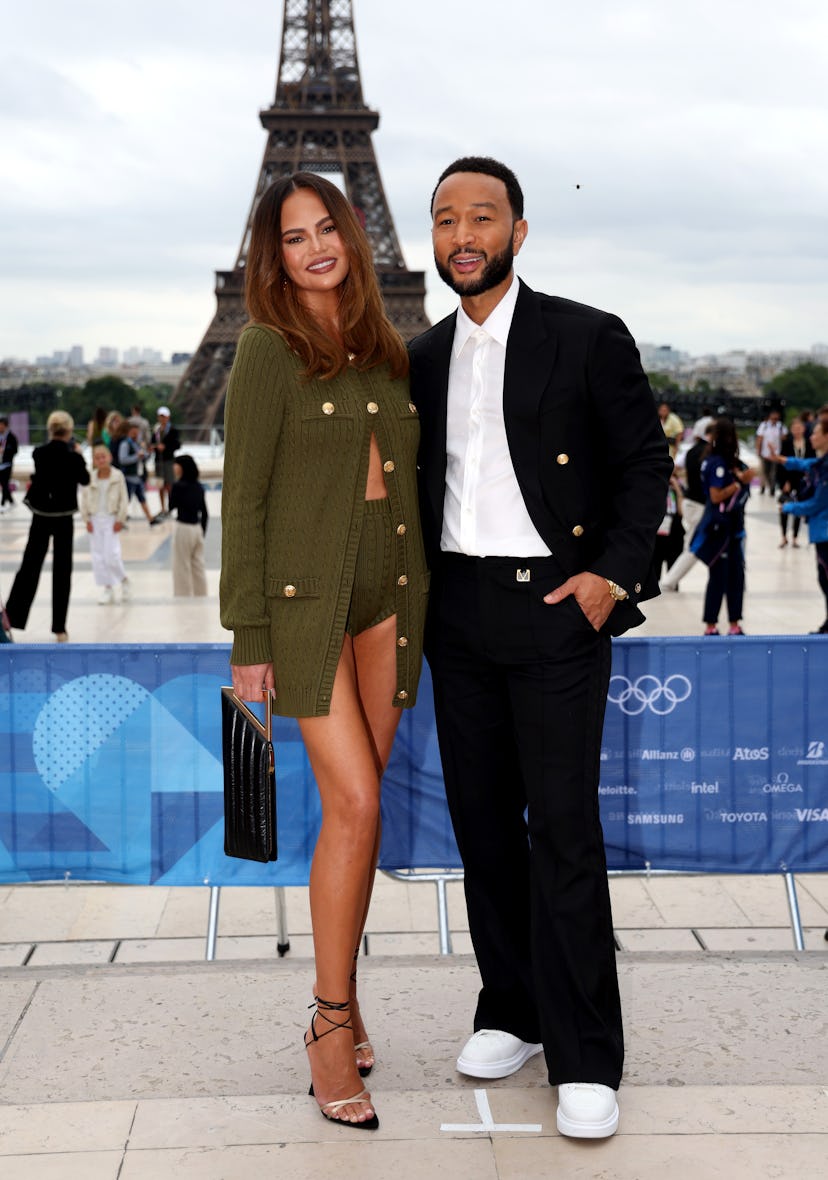 PARIS, FRANCE - JULY 26: Chrissy Teigen and John Legend attend the red carpet ahead of the opening c...