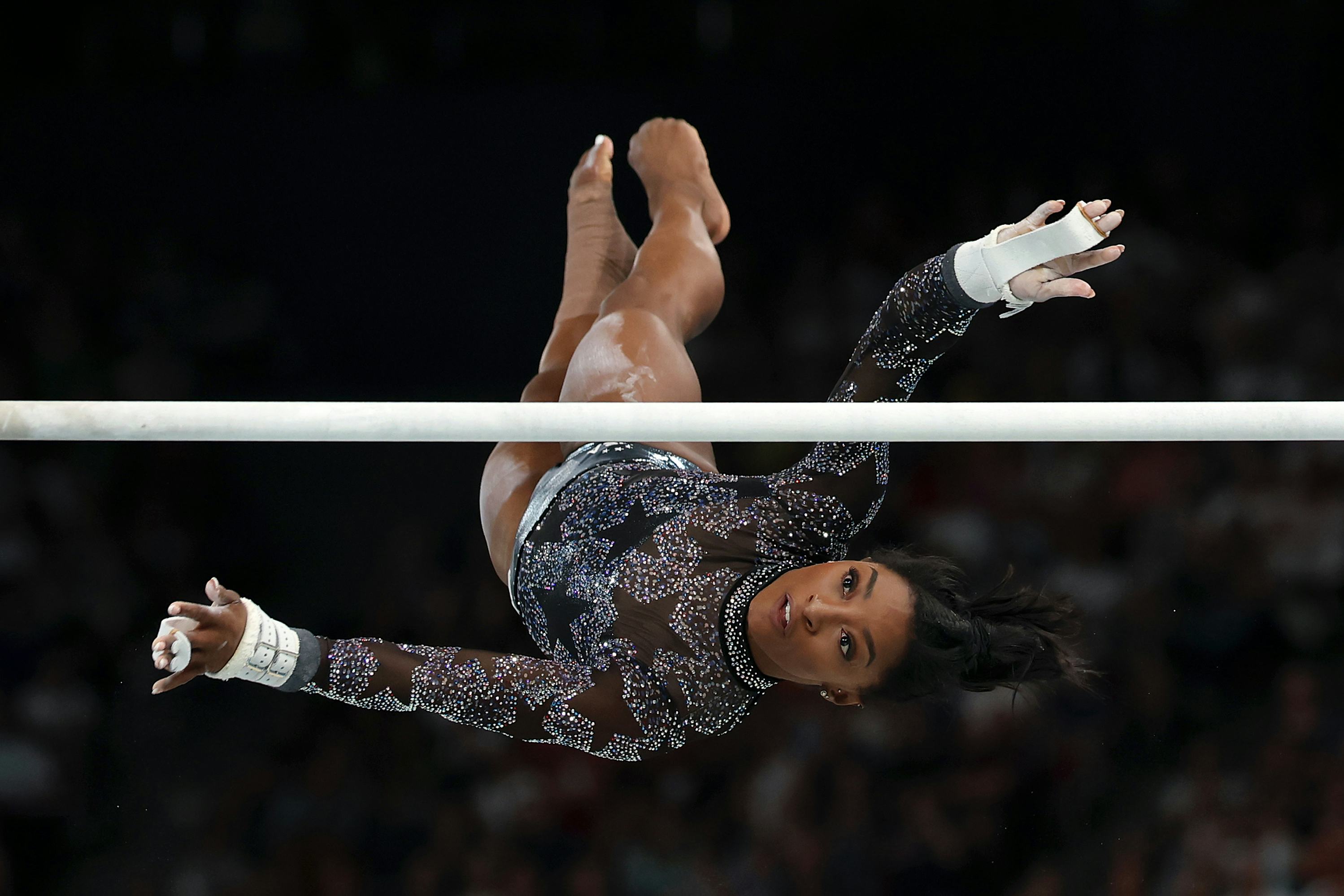 Simone Biles of Team USA competes on the uneven bars.