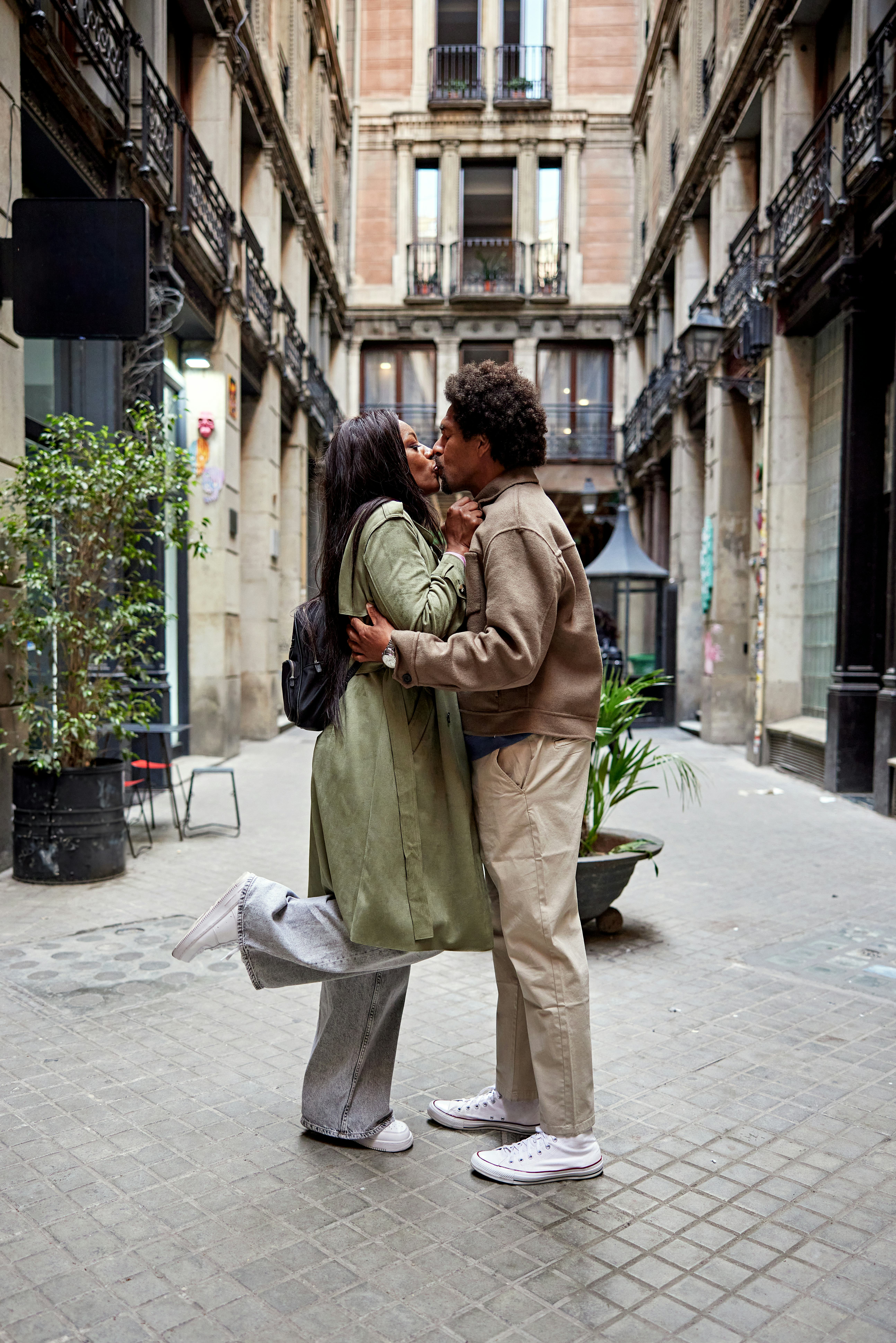 couple kissing in a street