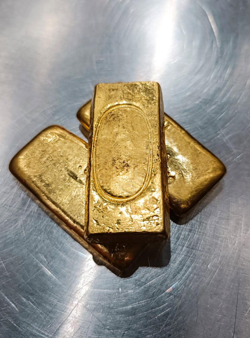 stack of gold bars stack of gold bars, conceptual photo of the gold price surge