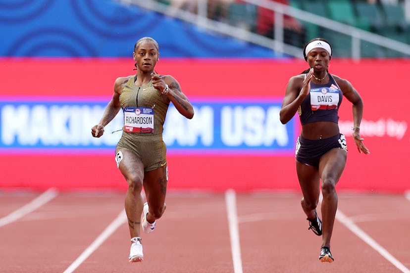 Sha’Carri Richardson and Tamari Davis compete in the first round of the women’s 200 meters.