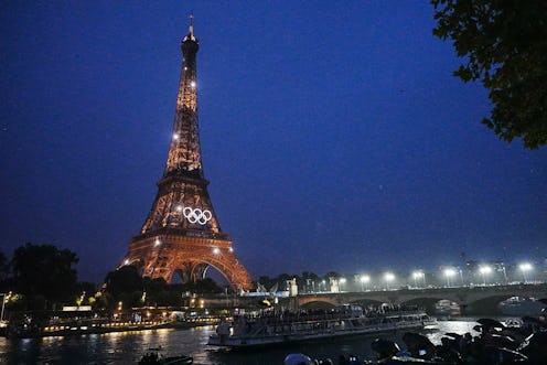 PARIS, FRANCE - JULY 26: Lights illuminate the Eiffel Tower during the opening ceremony of the Paris...