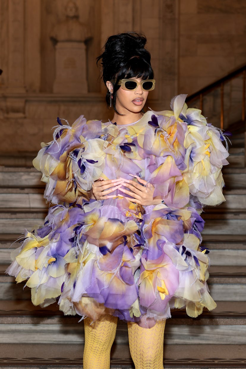 Cardi B wears a floral mini to attend the Marc Jacobs fashion show at the New York Public Library on…