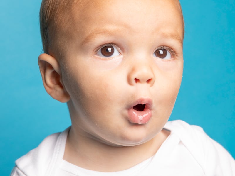 An 11 month old baby boy making a cute facial expression.