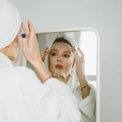 Young beautiful woman with a beauty face mask