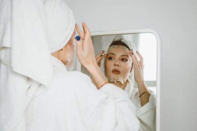 Young beautiful woman with a beauty face mask