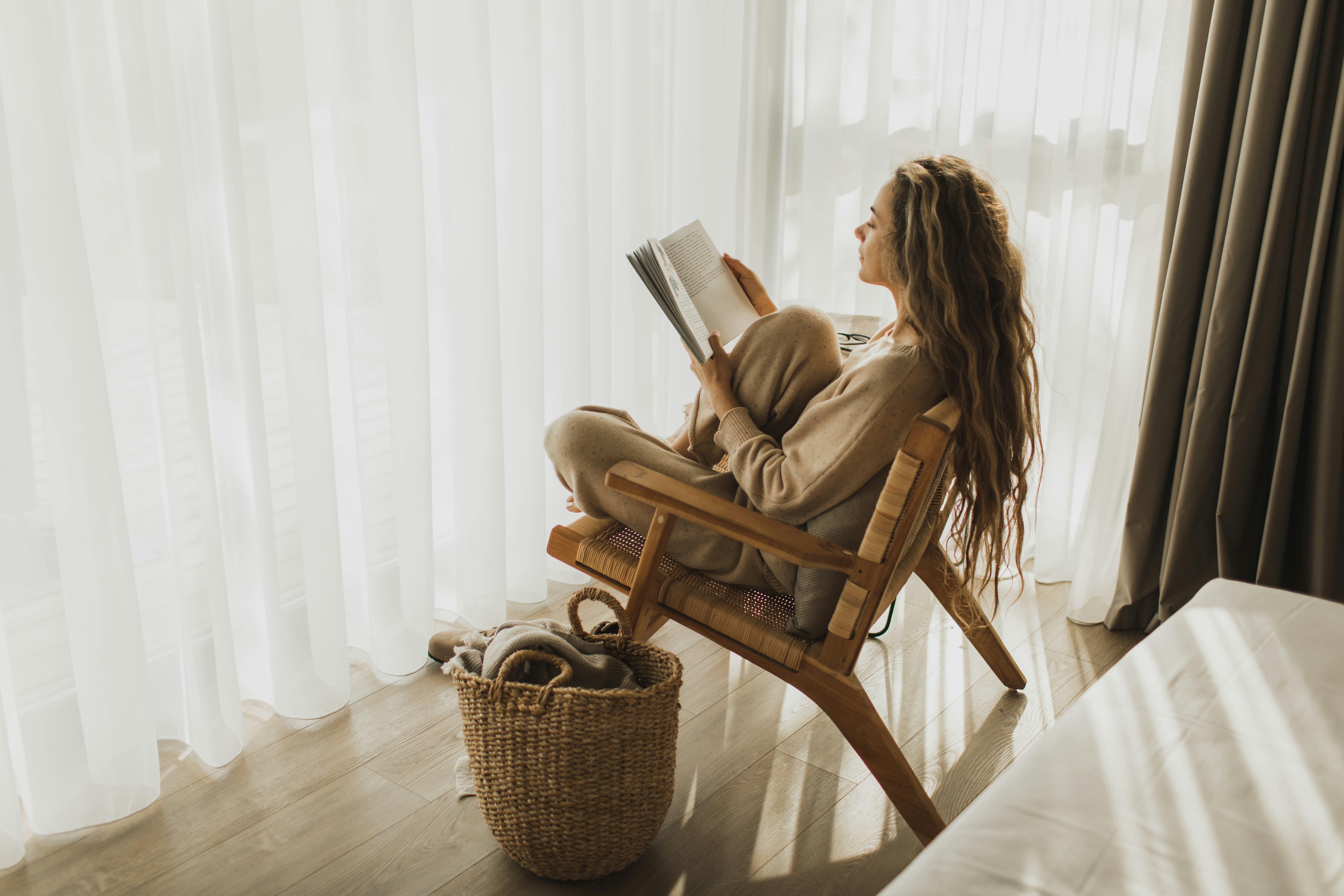 woman at home reading book