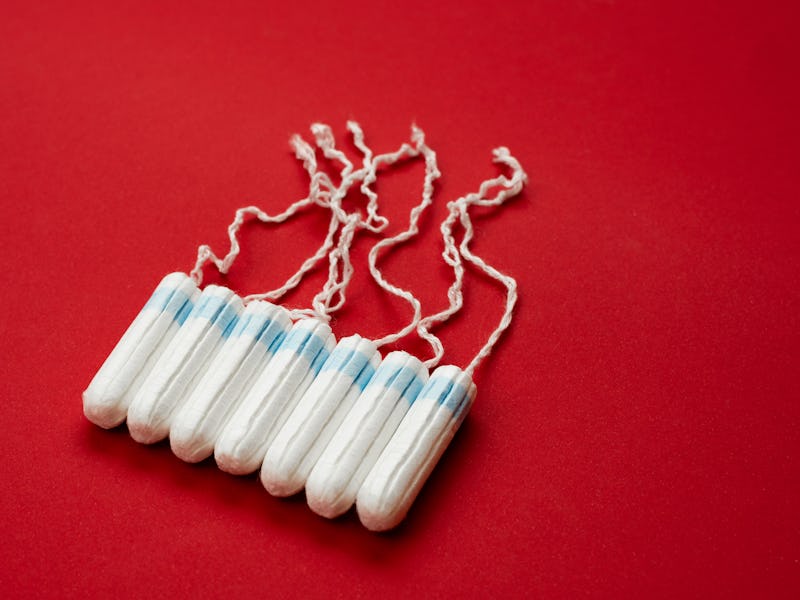 Tampons isolated on red background. Concept women sanitary protect