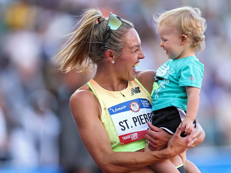 EUGENE, OREGON - JUNE 24: Elle St. Pierre celebrates with her son Ivan after winning in the women's ...