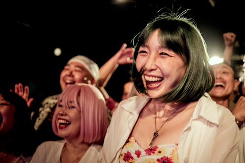Group of people having fun at music concert