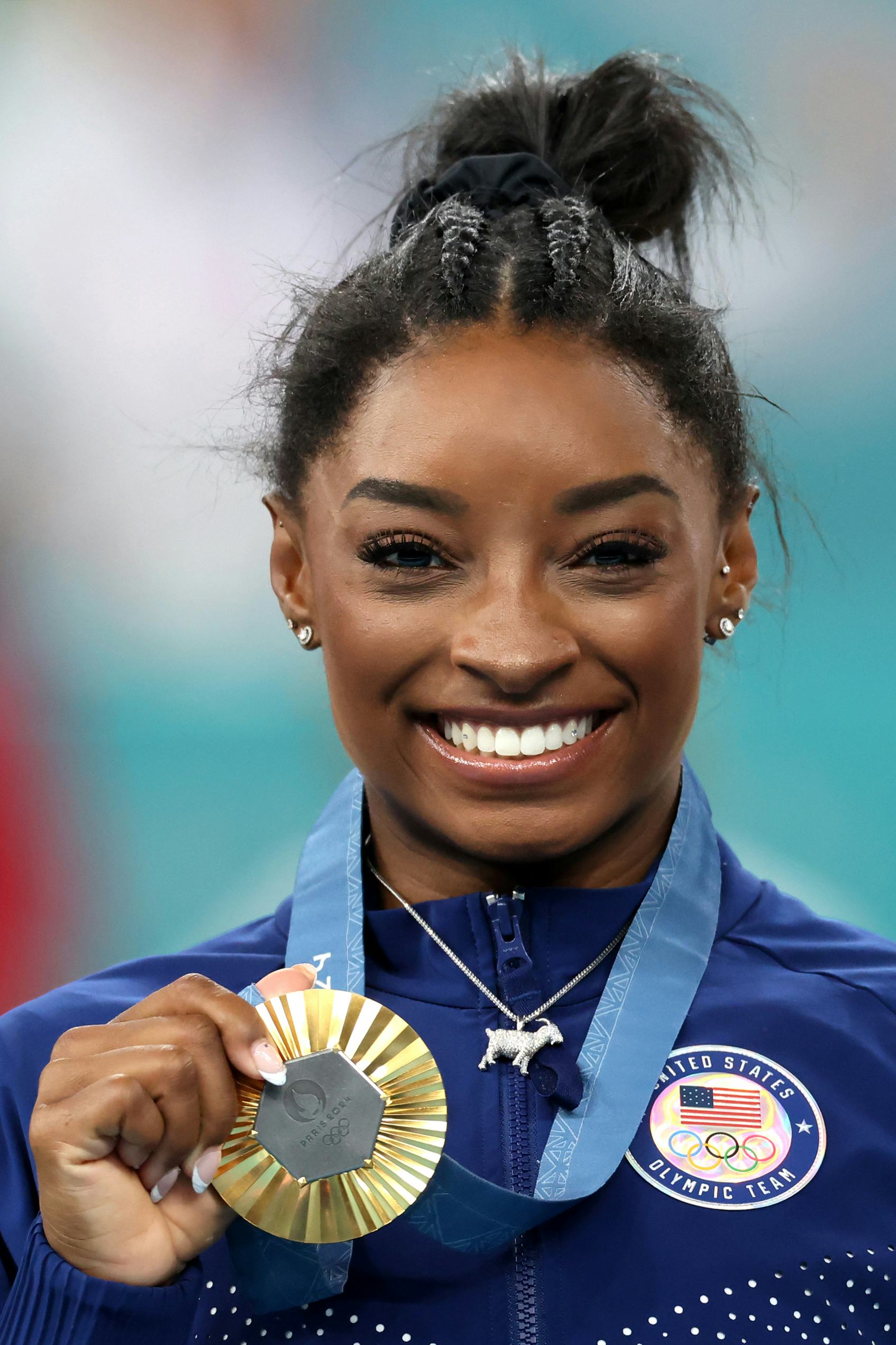 Simone Biles' best look No. 8: GOAT necklace.