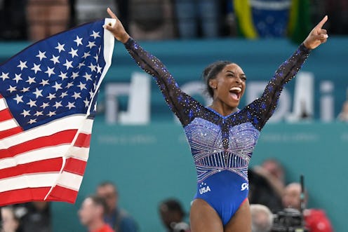 Simone Biles from USA celebrates gold. 