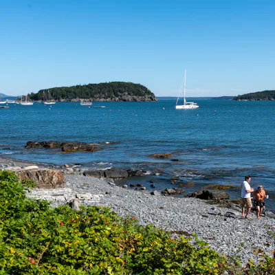 Bar Harbor, ME - September 17: Two people walk along Bar Harbor Town Beach on a sunny weekend morning, a day after Post-Tropical Storm Lee hit the area. (Photo by Tanner Pearson/The Boston Globe via Getty Images)