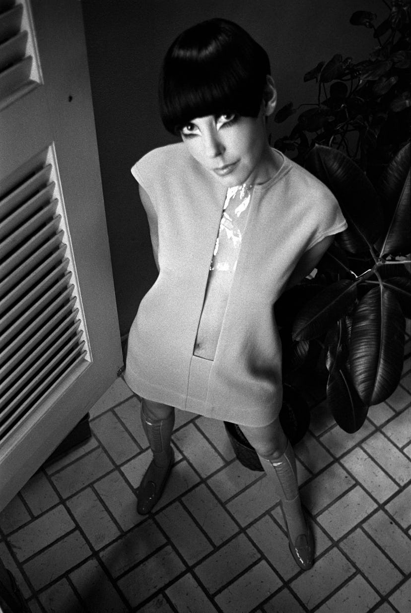 Model Peggy Moffitt wearing a short dress with clear plastic center panel from the spring/summer '68...